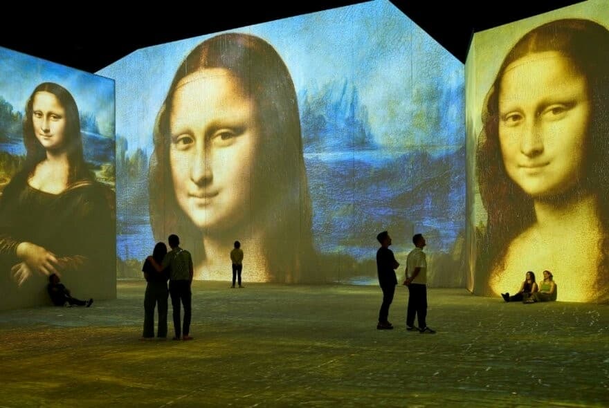 Melbourne King's Birthday Weekend: People enjoy a Mona Lisa art exhibition. Things to do in Melbourne.