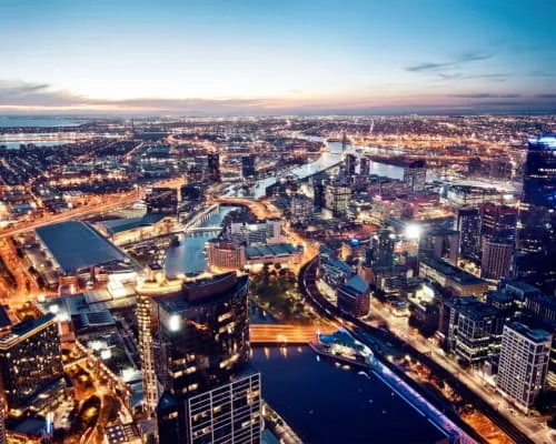 Melbourne city skyline at night. Hotels for Formula One attendees in Melbourne.